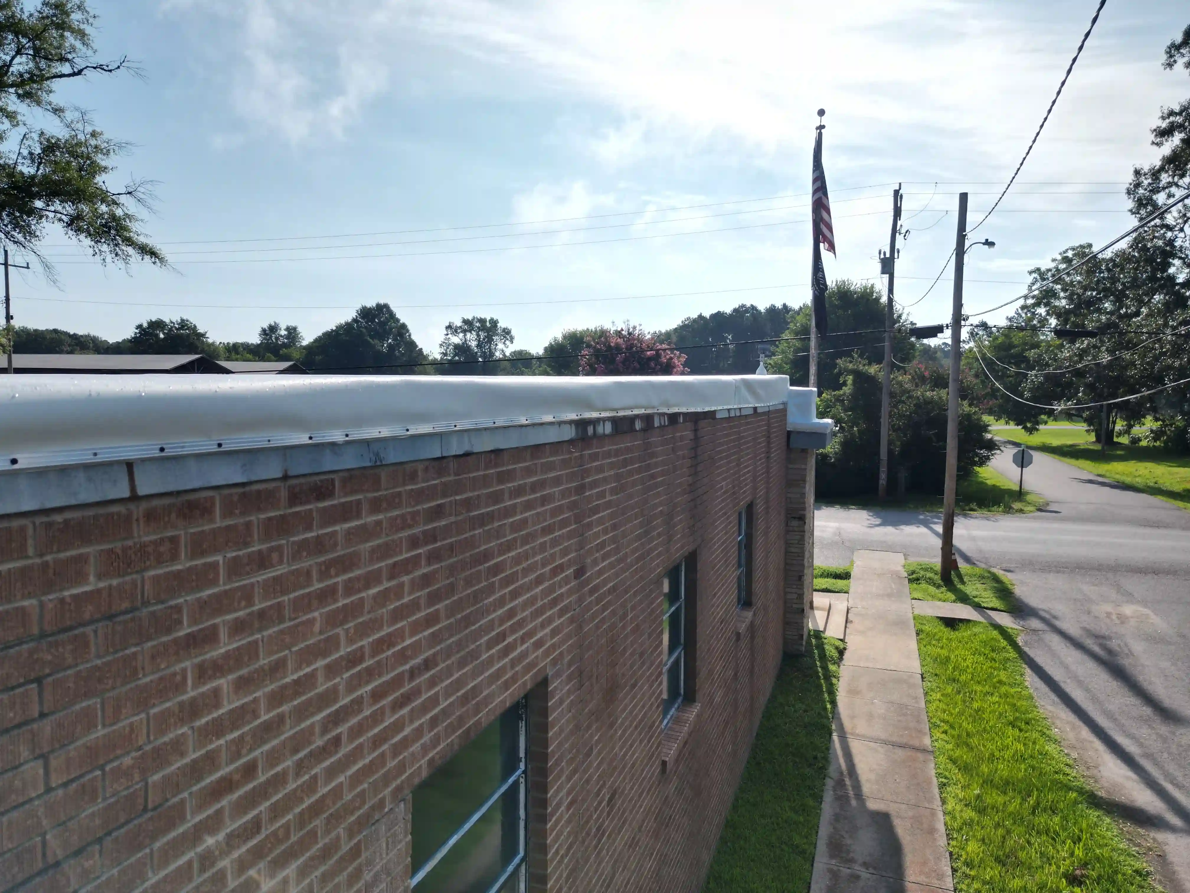 Small commercial building with a finished flat white membrane roof